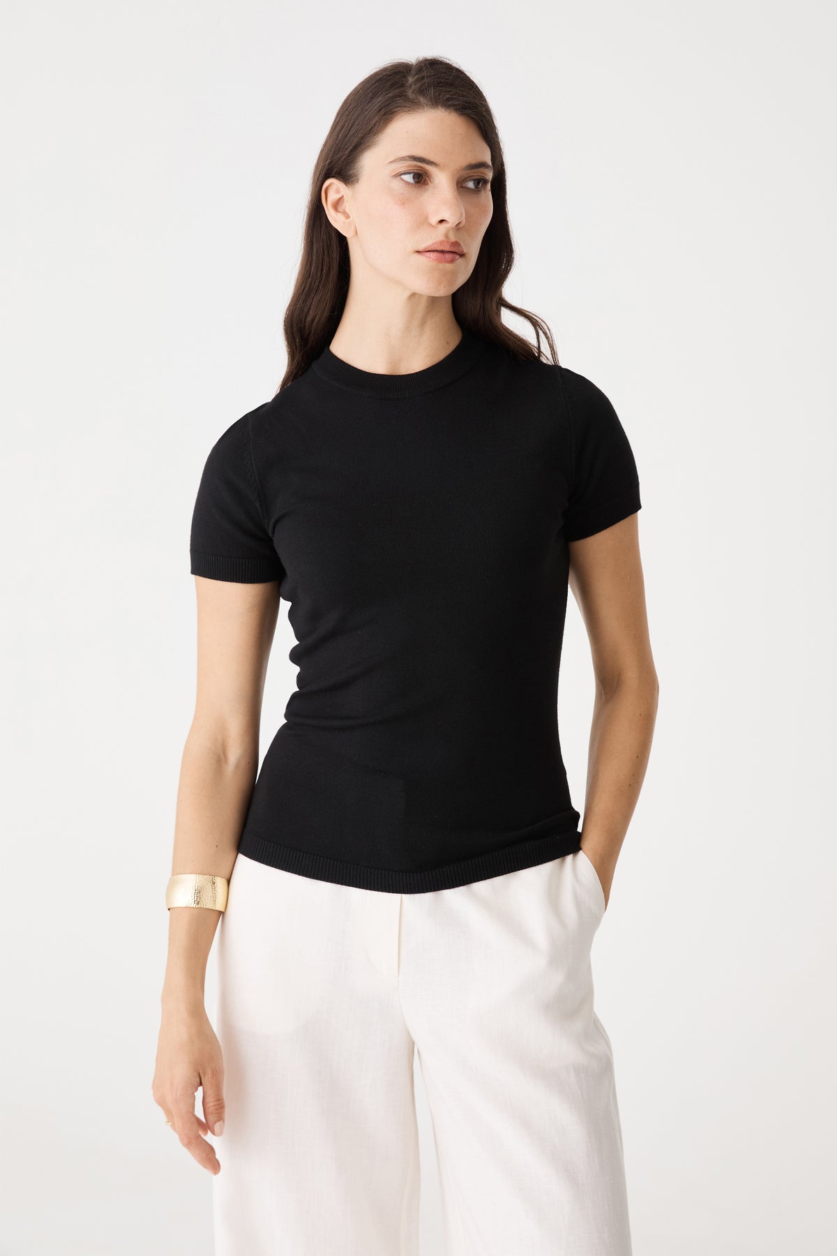 Front close view of the black Catherine Short Sleeve Knit showing crew neckline and ribbed edges