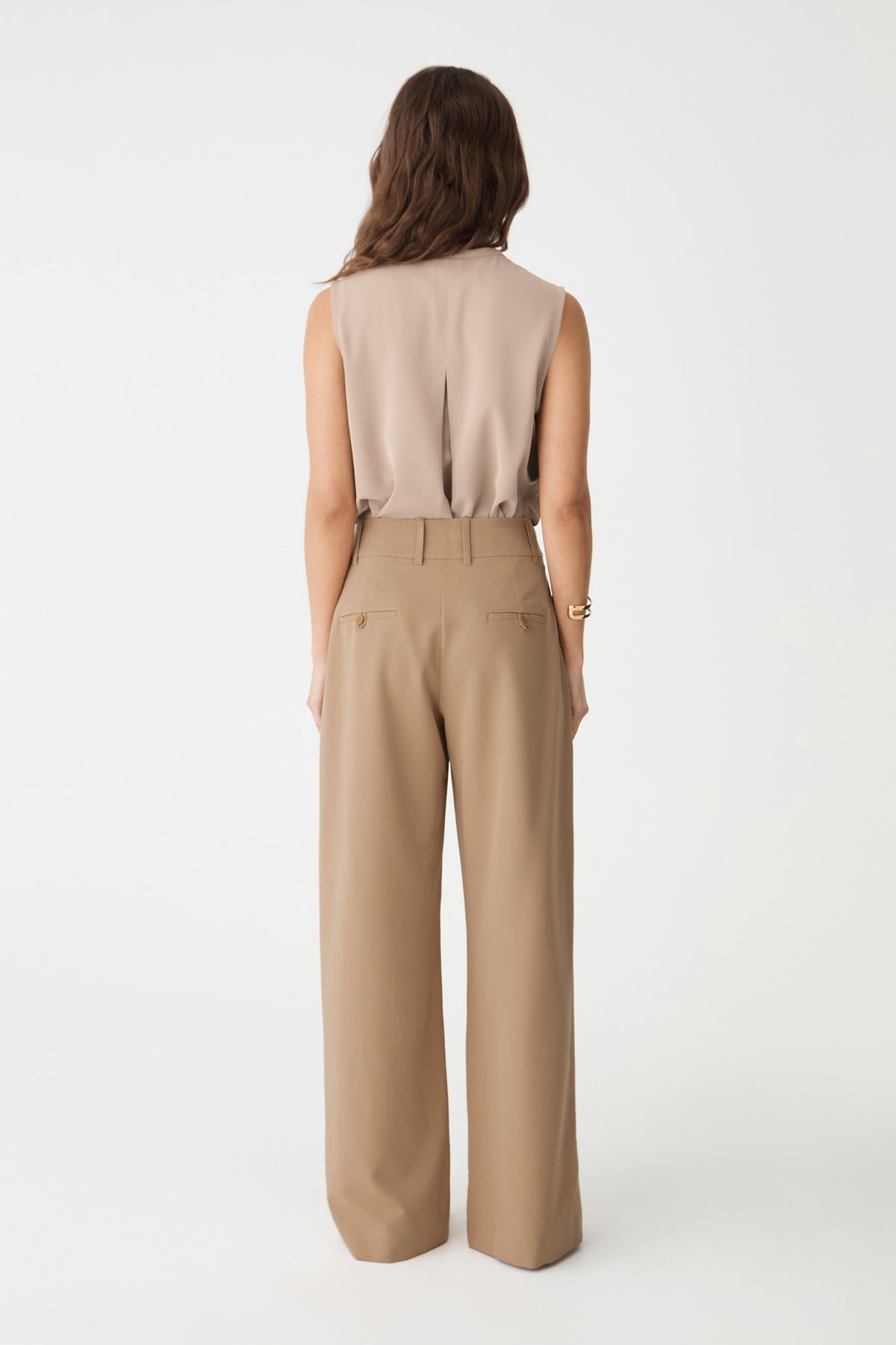 Back view of the bone top with back tuck detail