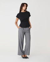 Bonnie Gathered Peplum Top in black — full-length view