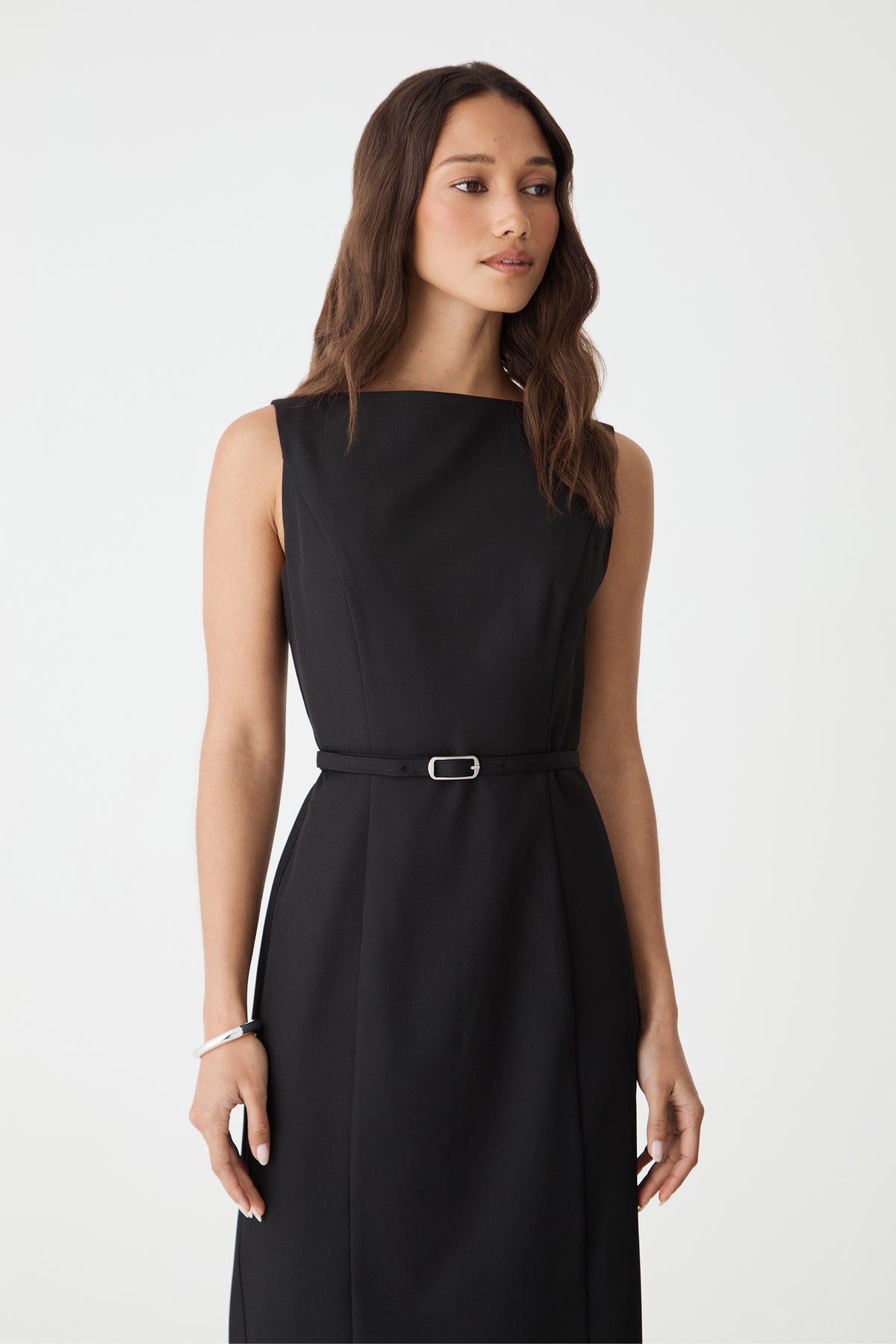 Close-up of the boat neckline and belted waist on the black Mila Pencil Midi Dress