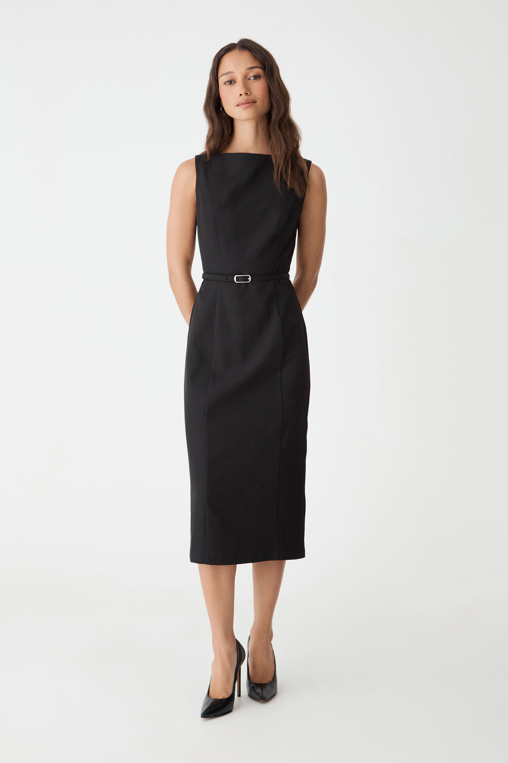 Mila Pencil Midi Dress in black, front view with slim belt at the waist, worn with black heels