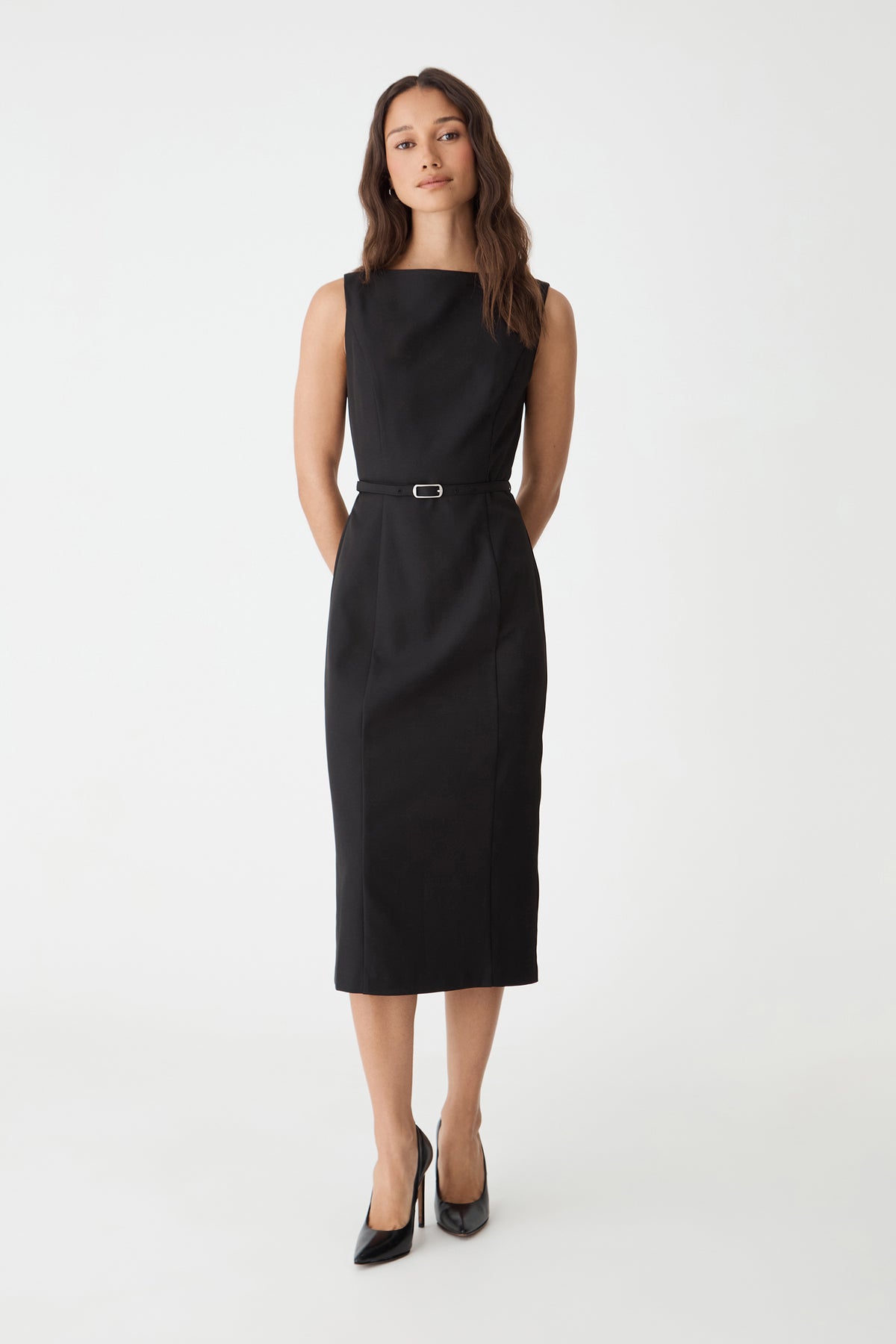 Mila Pencil Midi Dress in black, front view with slim belt at the waist, worn with black heels