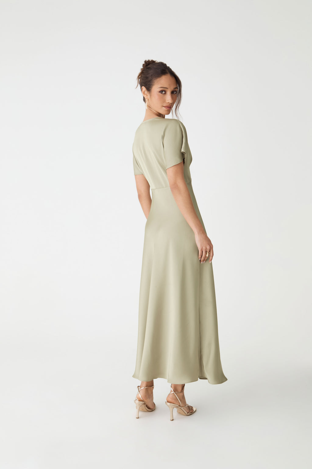 Back view of the sage Catalina V-Neck Satin Dress showing midi length skirt