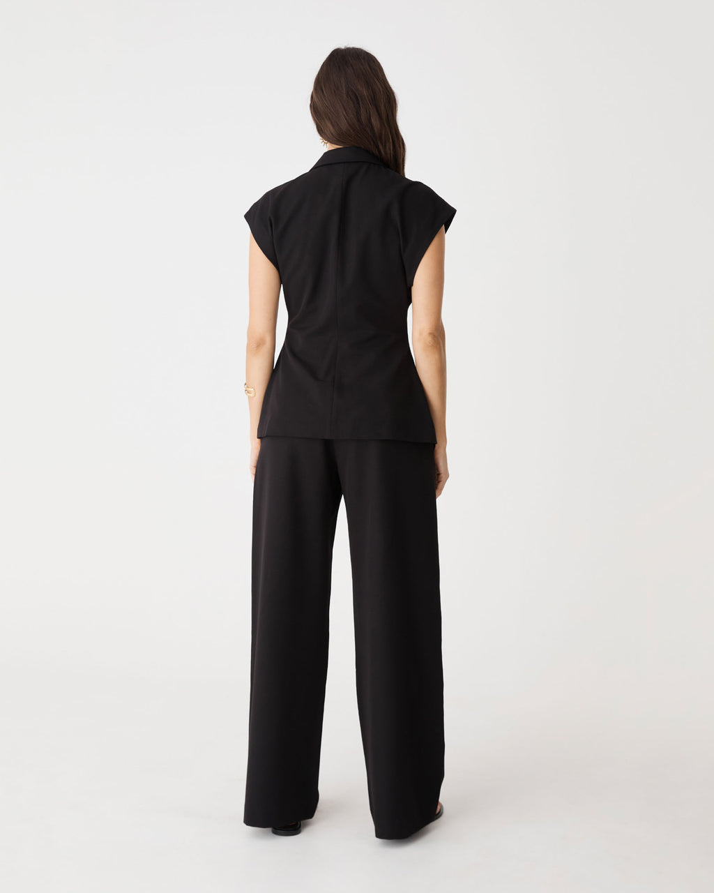 Back view of the black Milton Short Sleeve Blazer with wide leg pants