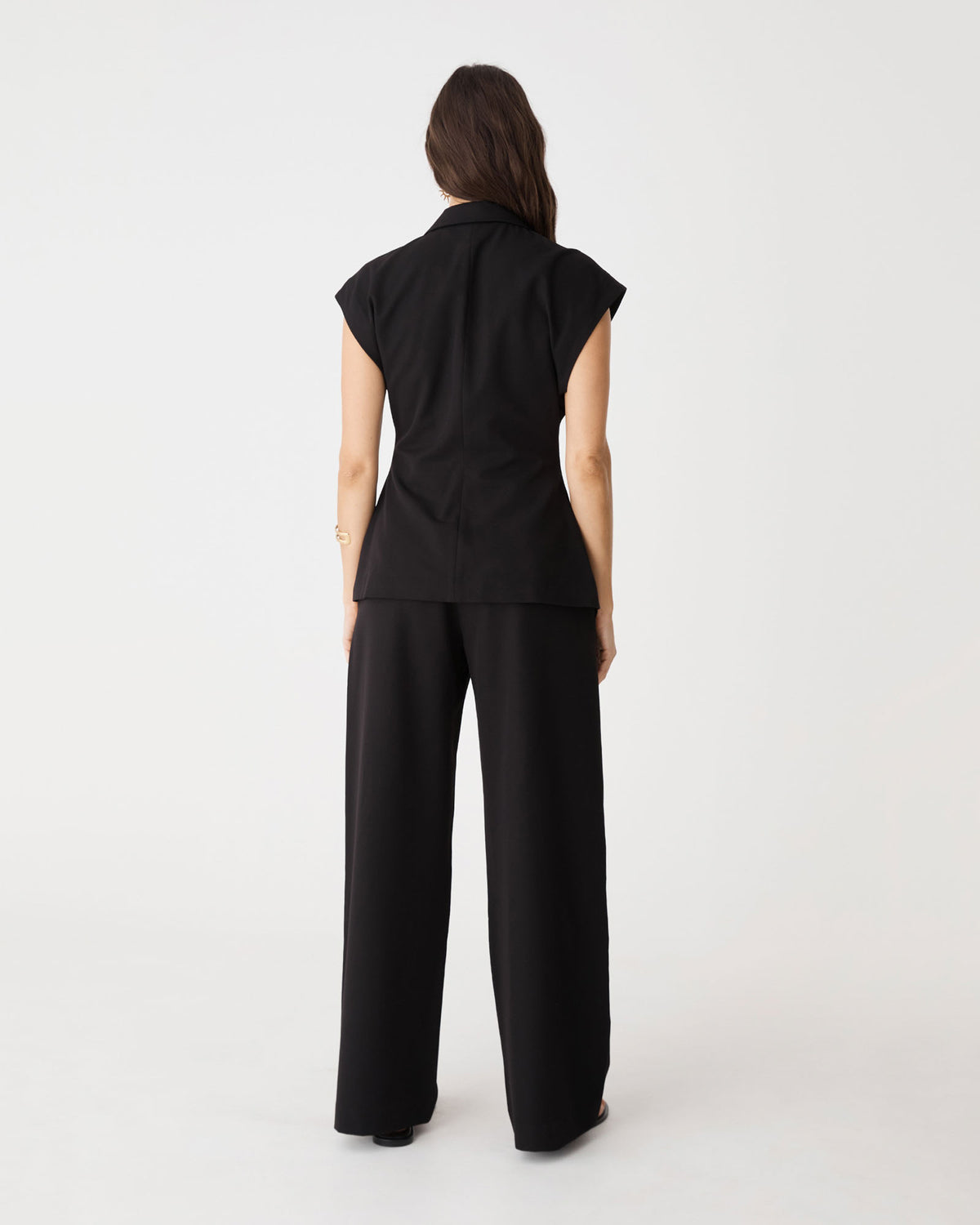 Back view of the black Milton Short Sleeve Blazer with wide leg pants