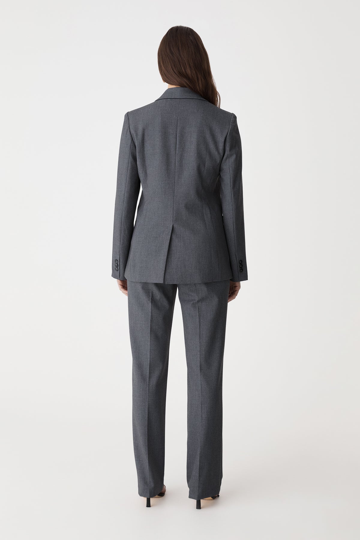 Back view of the dark grey Merid Tailored Pants with matching blazer