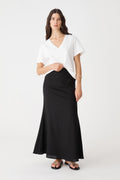 Amelia Linen Blend Maxi Skirt in black, front view worn with a white V-neck tee