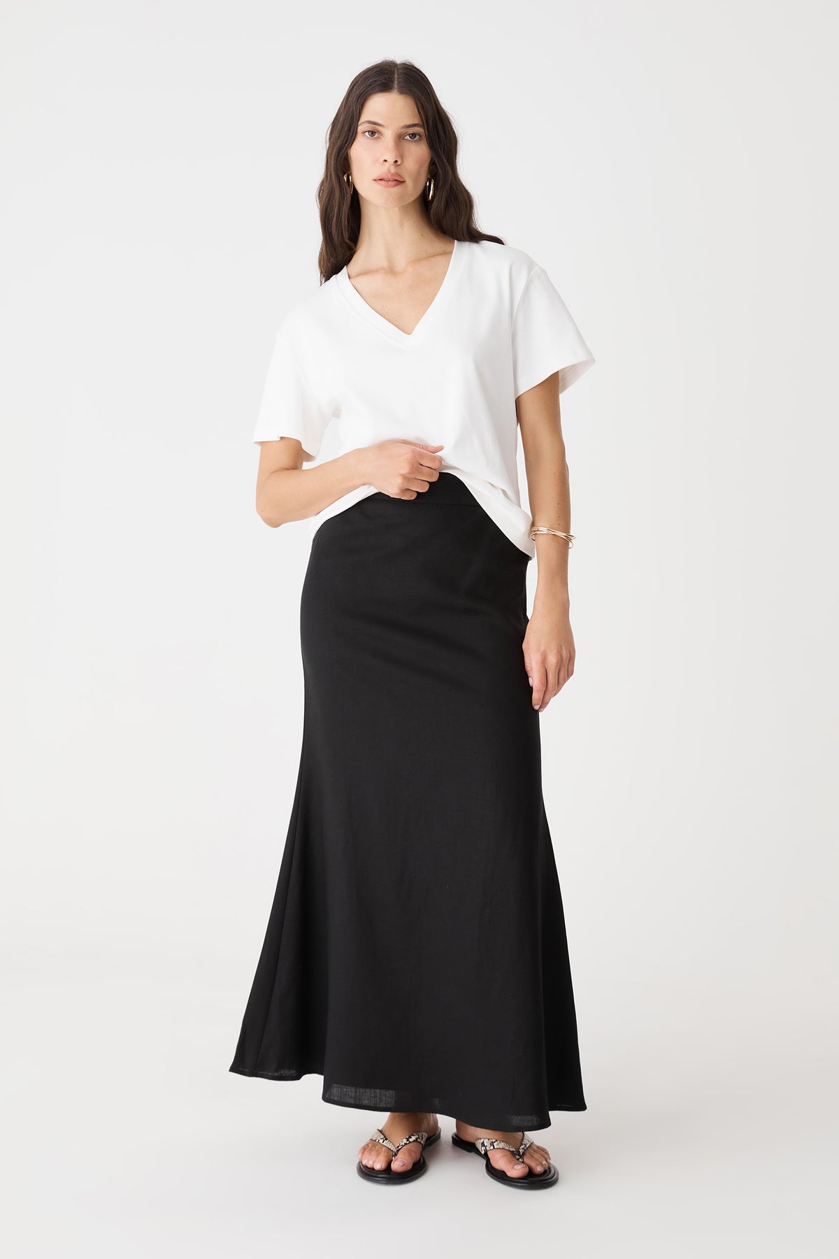 Amelia Linen Blend Maxi Skirt in black, front view worn with a white V-neck tee