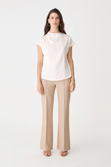 Zafina Pleated Draped Top in pearl, front view with cap sleeves, worn with beige trousers