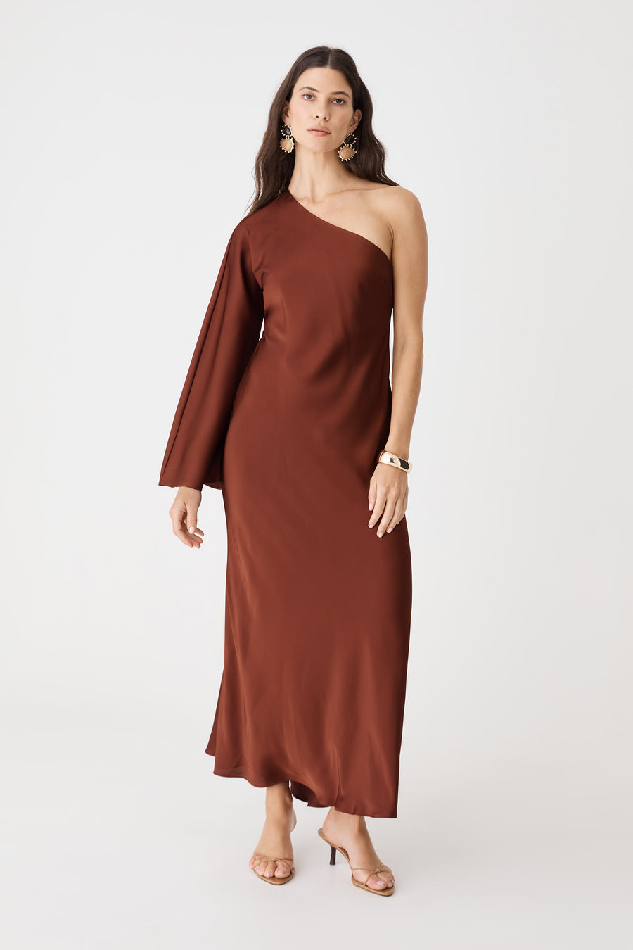 Cleo One Shoulder Satin Dress in brick, front view of maxi length with single flared sleeve