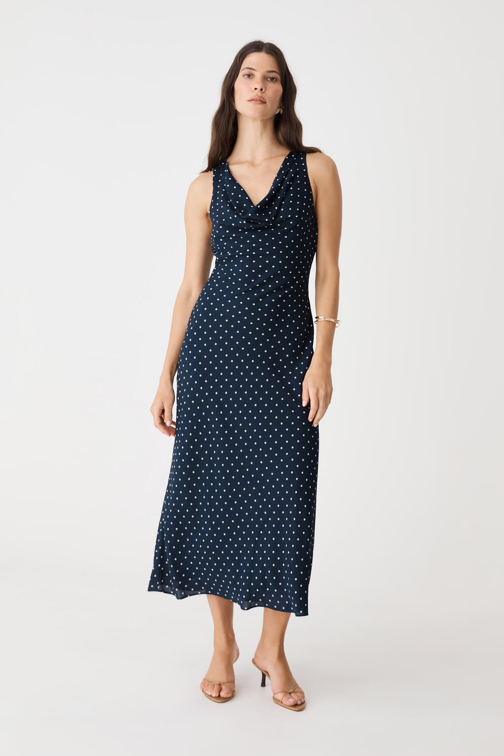 Danielle Bias Cowl Dress in navy spot, front view of sleeveless midi dress with white polka dot print