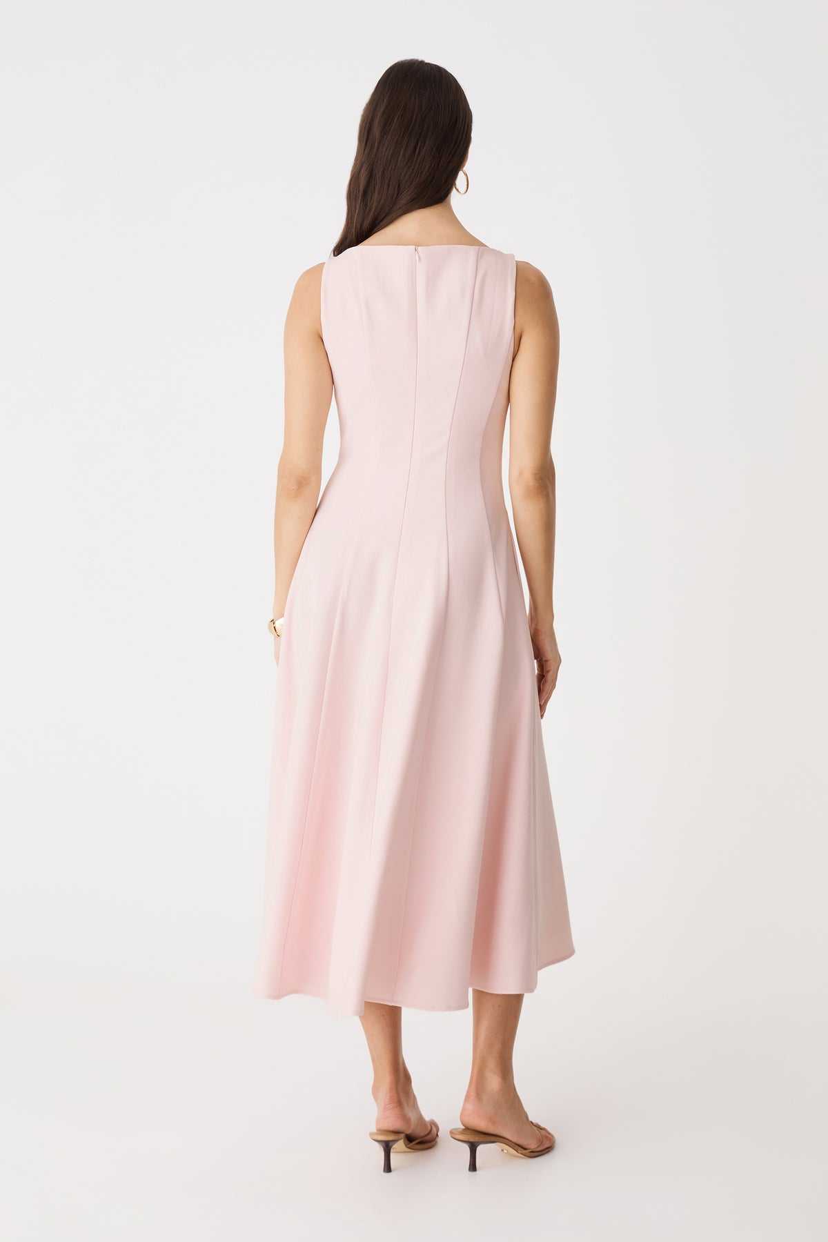 Back view showing invisible zipper and flared midi skirt