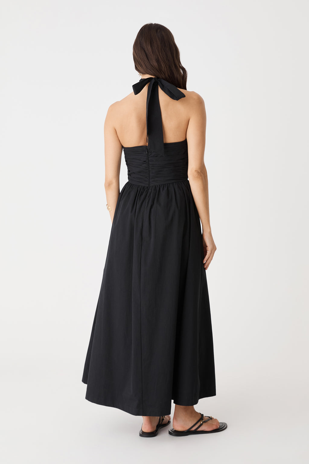 Back view showing open back and neck tie of the black Kayleigh Cotton Halter Dress