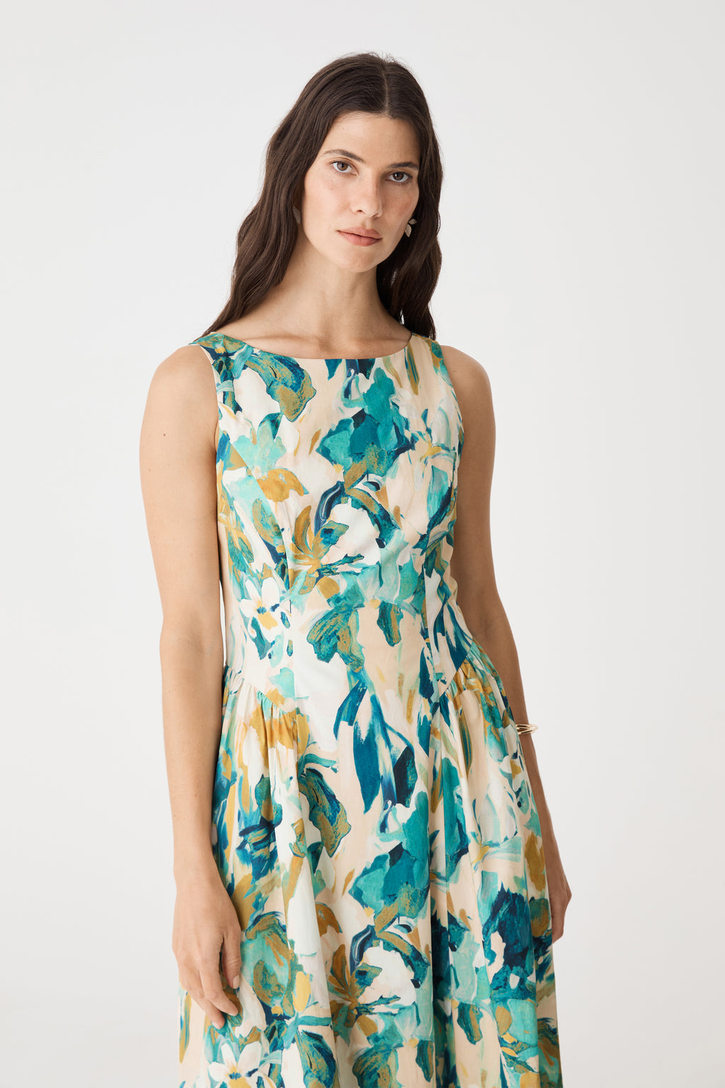 Close-up of Liza Gather Detail Print Dress in Teal Watercolour floral print, boat neckline and sleeveless bodice