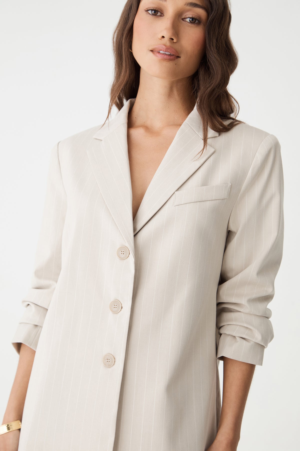Close-up of the notch collar, chest pocket and three-button front