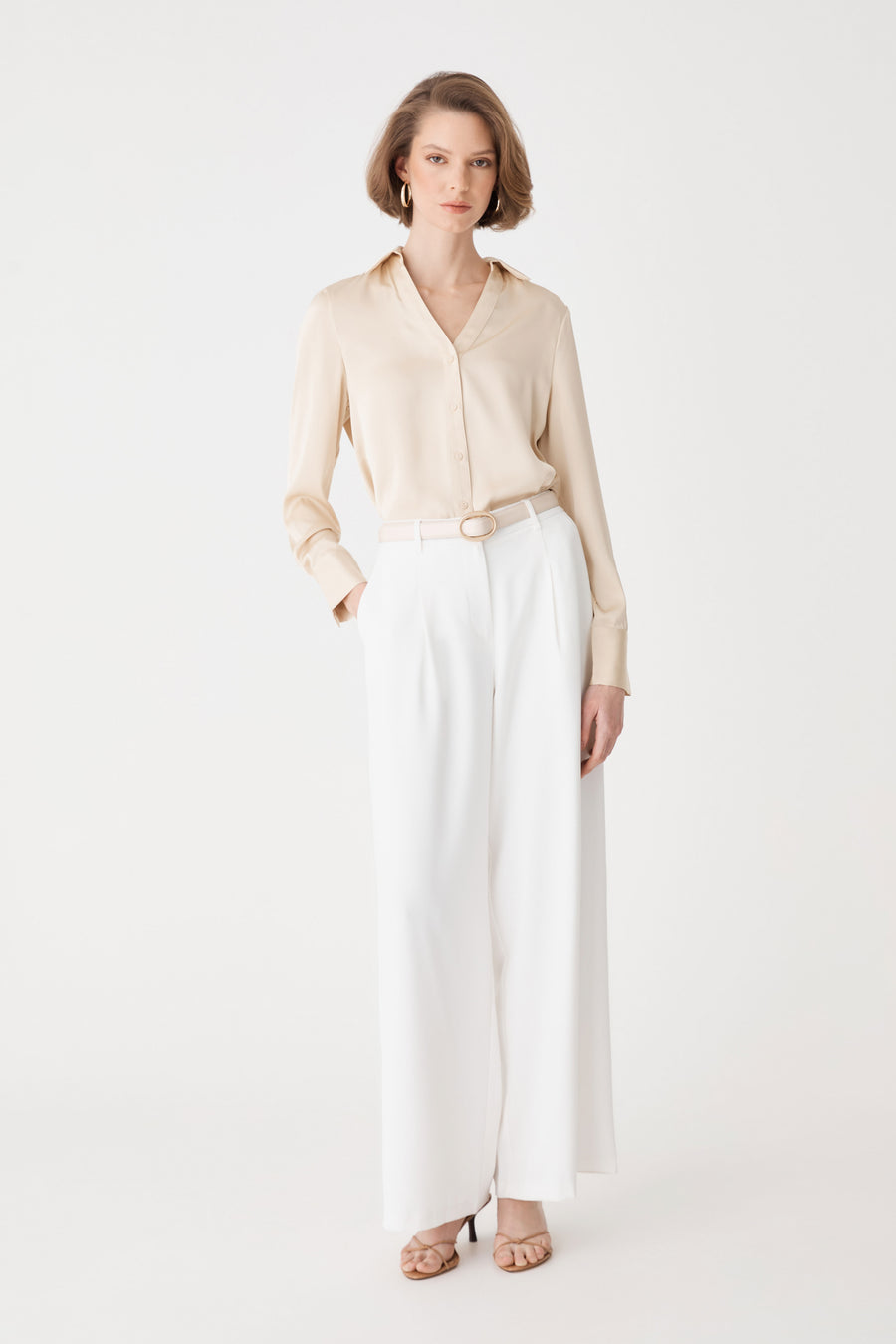 Daphne Pleated Crepe Pants in ivory, front view, worn with a beige shirt tucked in