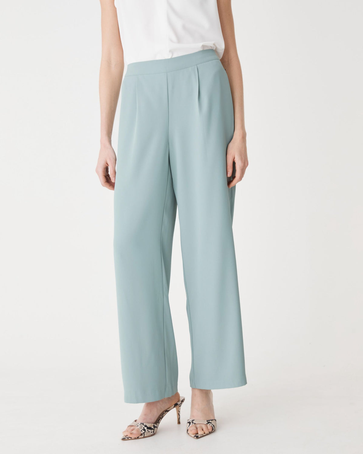 Front close-up of the flat-front waistband and pleats on the Eucalyptus wide-leg pants
