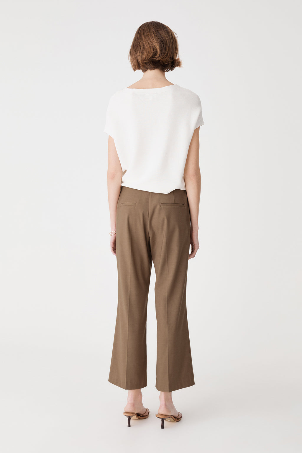Back view showing dual back welt pockets on the Cedar Marle crop flare pants