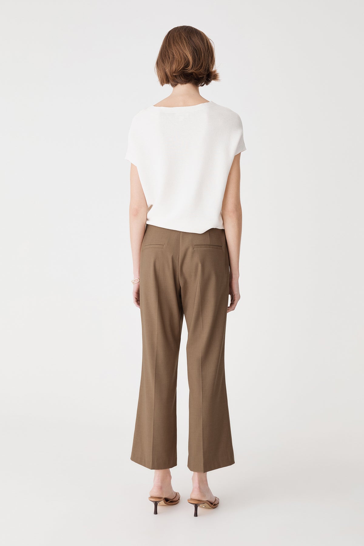 Back view showing dual back welt pockets on the Cedar Marle crop flare pants