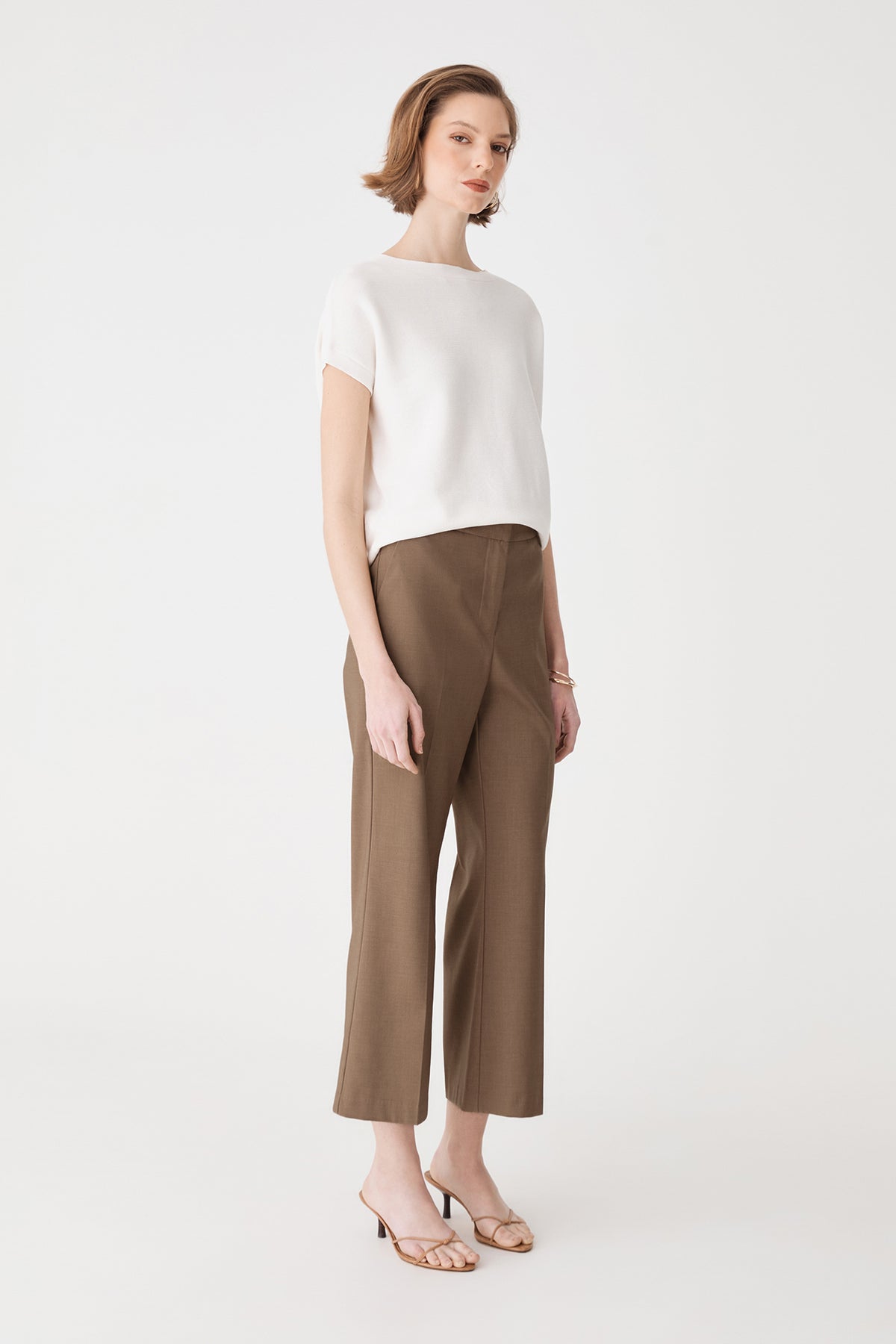 Side view of the Milan Crop Flare Pants in Cedar Marle showing wide flare leg