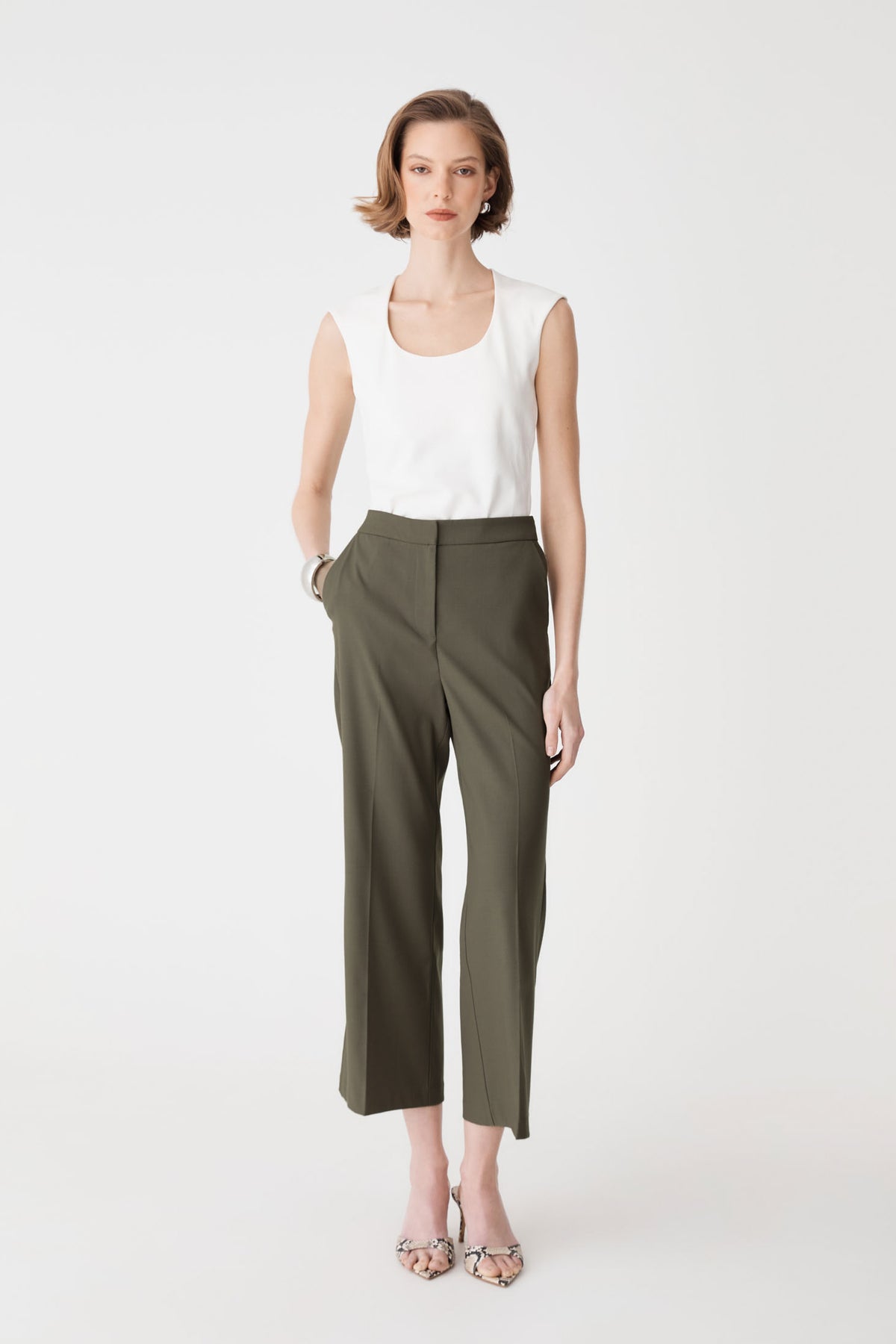 Milan Crop Flare Pants in khaki, front view worn with a white sleeveless top