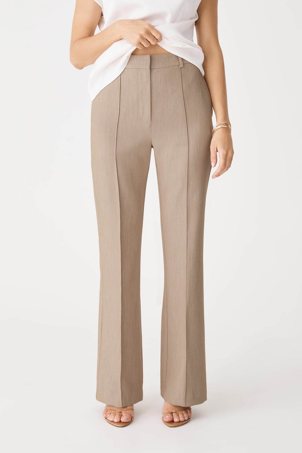 Julia Bootleg Pants in Mocha, front view showing pintuck seams and waistband, worn with white top