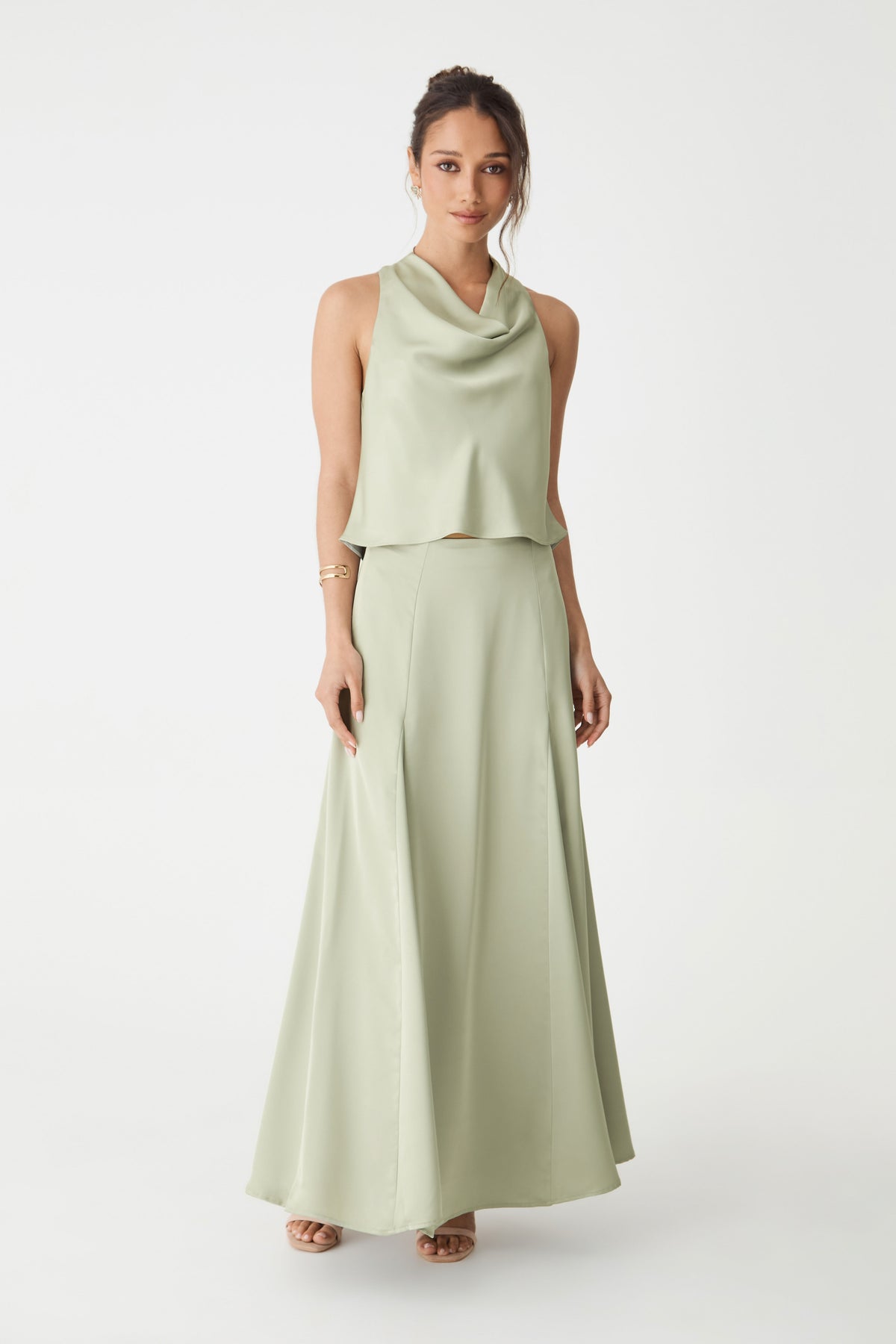 Front view of the pistachio Freya Satin Godet Skirt showing the flared maxi hem, worn with a matching top