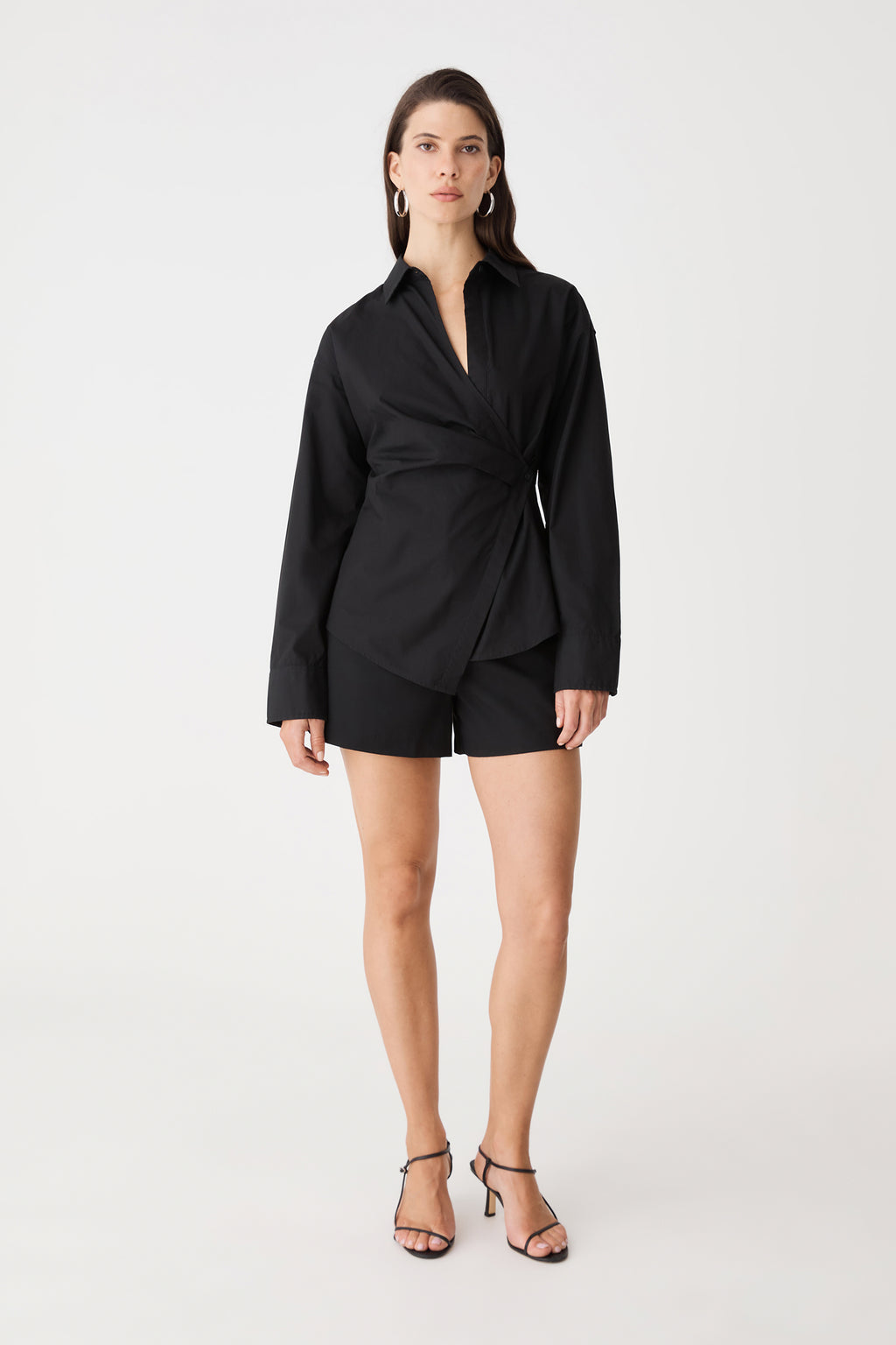 Katrina Wrap Shirt in black, front view worn with black shorts