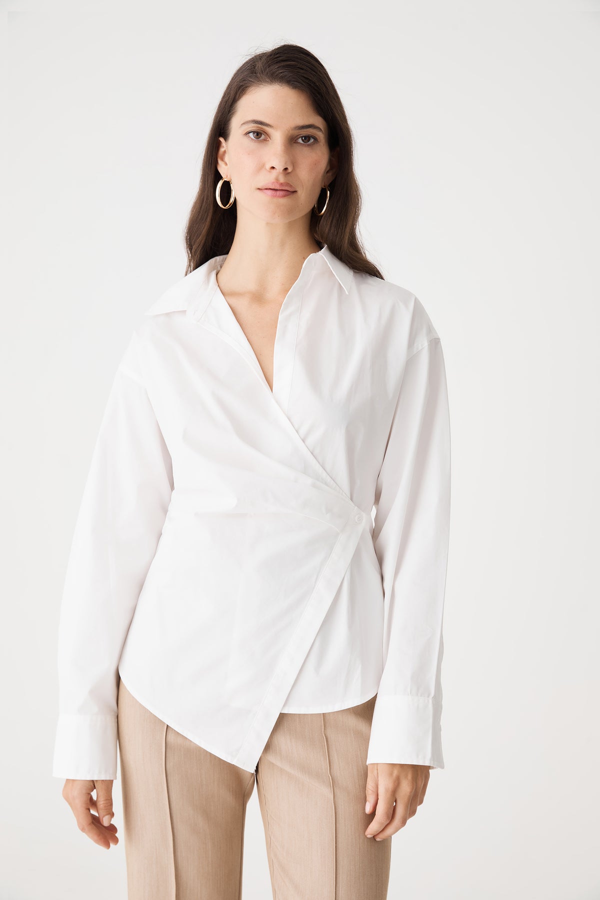 Front close-up of the ivory wrap shirt showing asymmetrical wrap front and pointed collar