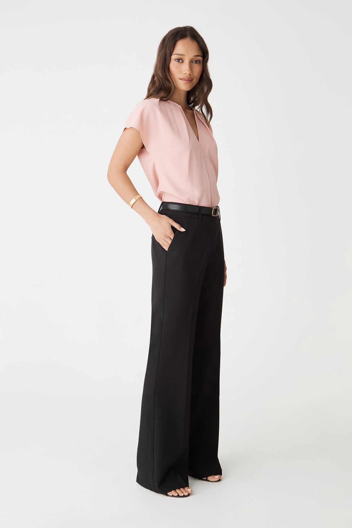 Side view of the Pink Sand top showing shoulder pleating and dolman sleeve