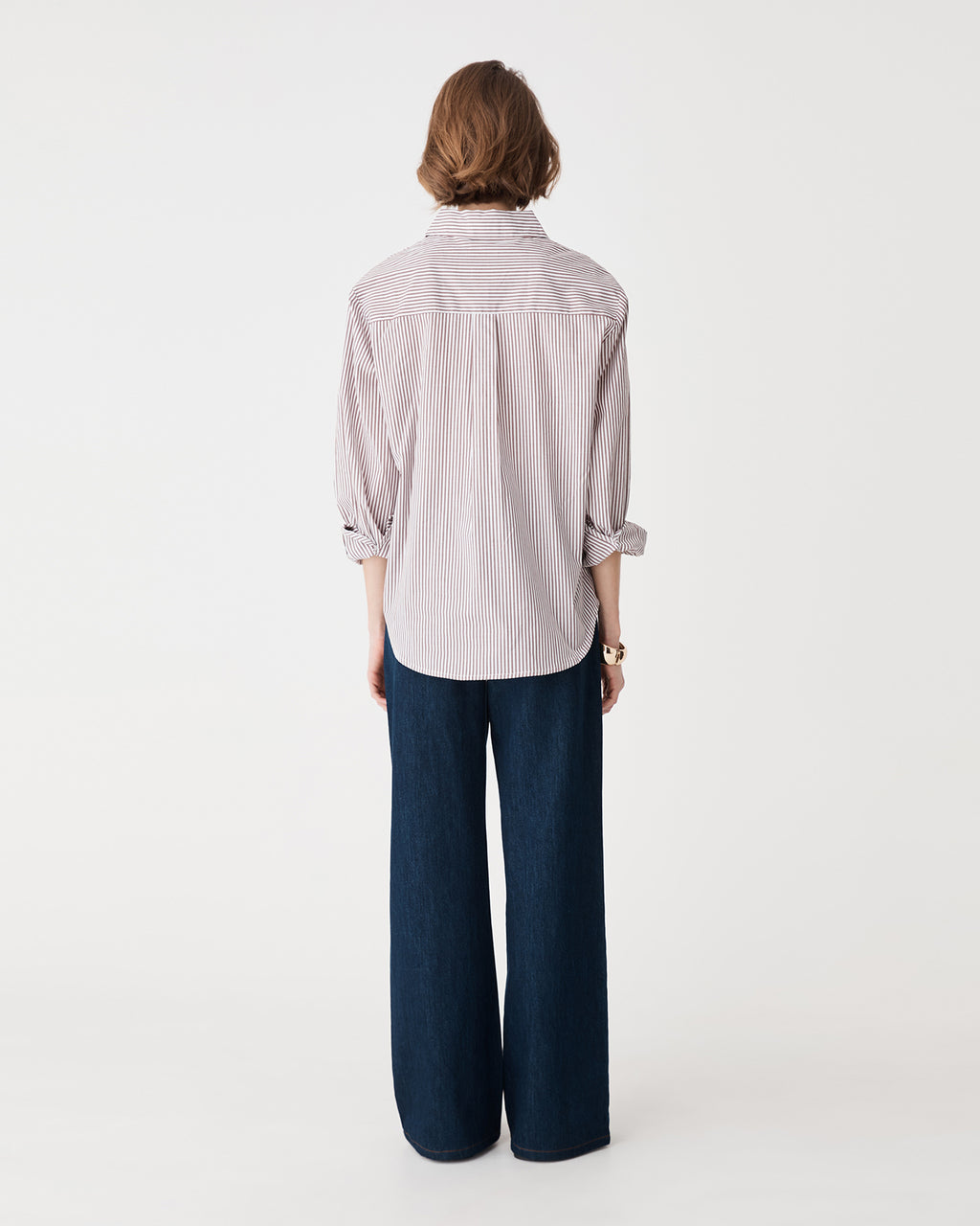 Back view of the brown stripe shirt with navy wide-leg trousers
