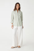 Samara 2 Cotton Striped Shirt in green stripe, front view worn open over white wide-leg trousers