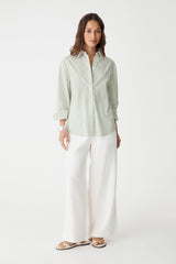Samara 2 Cotton Striped Shirt in green stripe, front view worn open over white wide-leg trousers