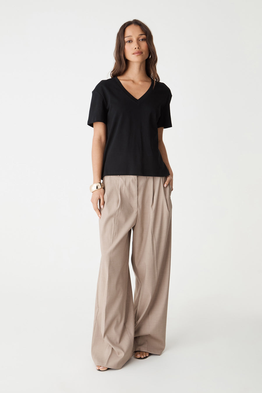 May V-Neck Cotton T-Shirt in black, front view worn untucked with beige wide-leg pants
