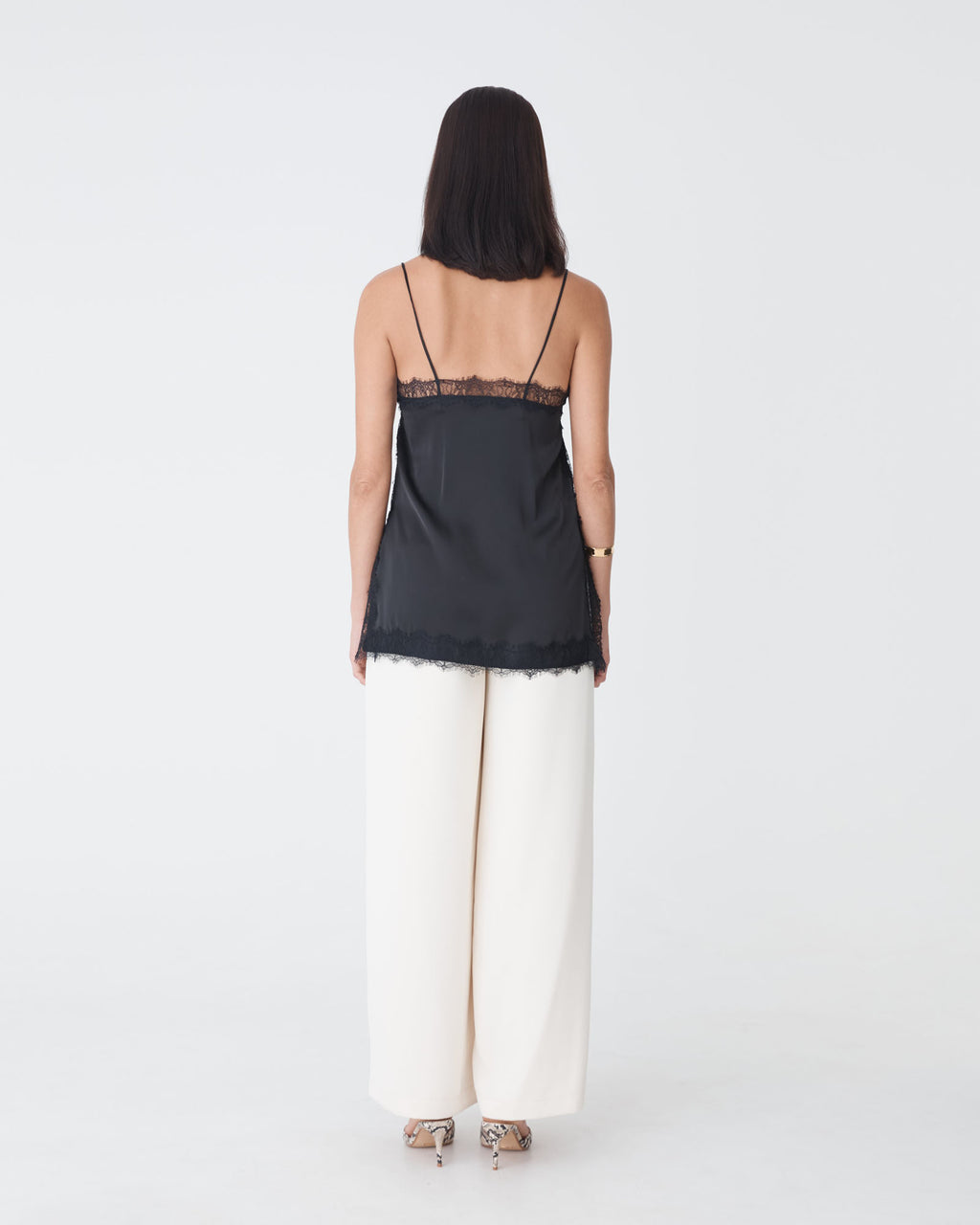 Cleo Lace Trim Satin Camisole in black — back view