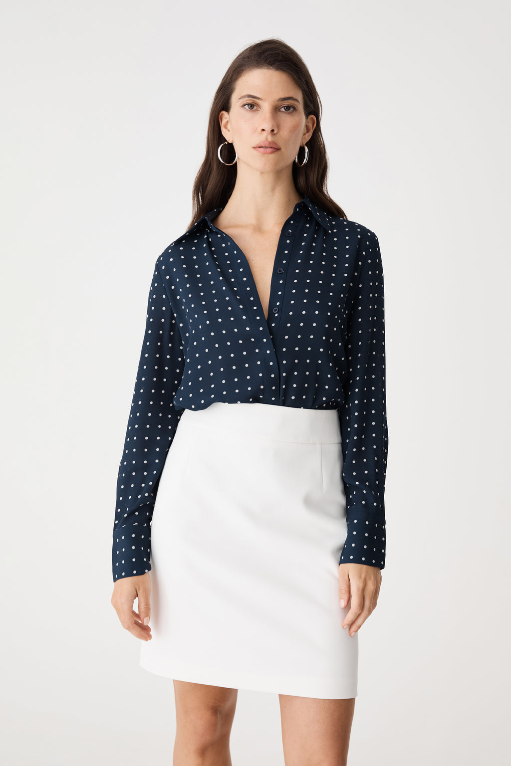 Close-up front view of the navy spot shirt showing the concealed button placket and collar