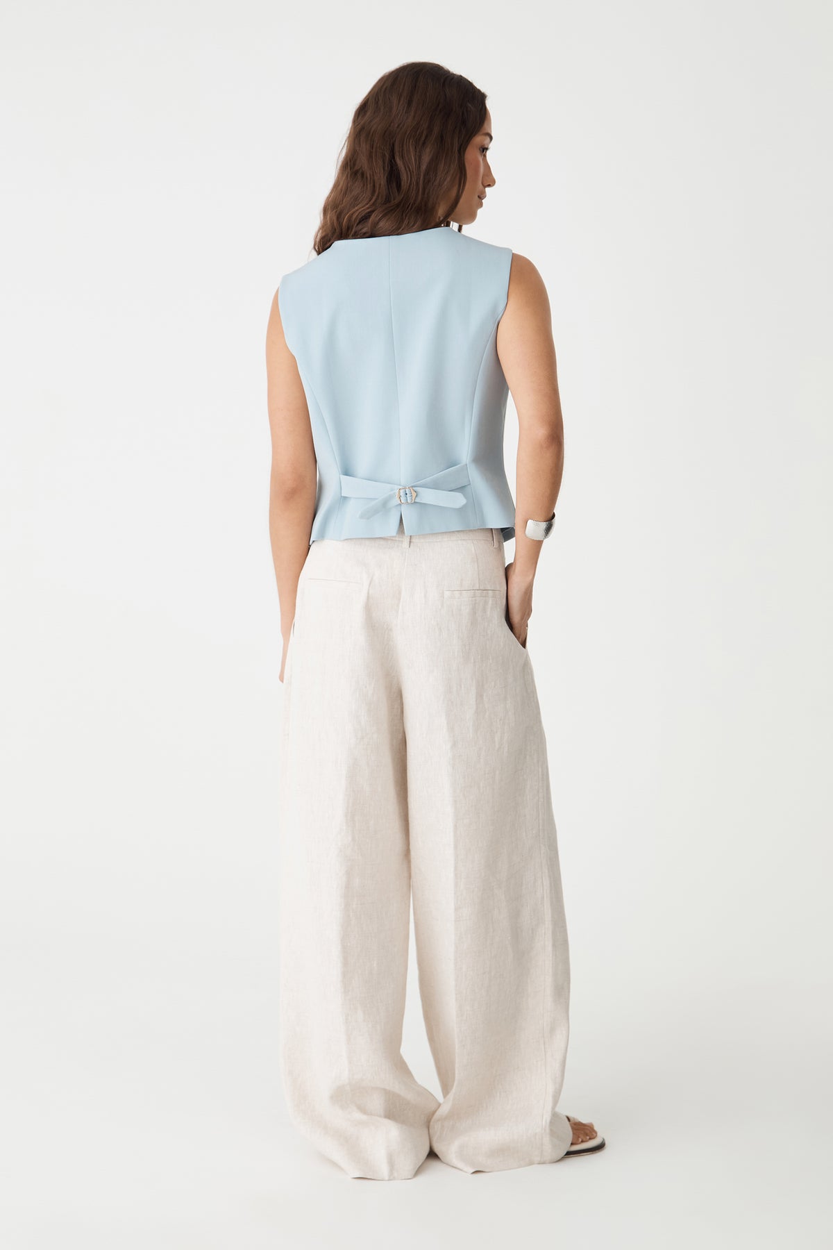 Back view showing the adjustable back strap with metal buckle