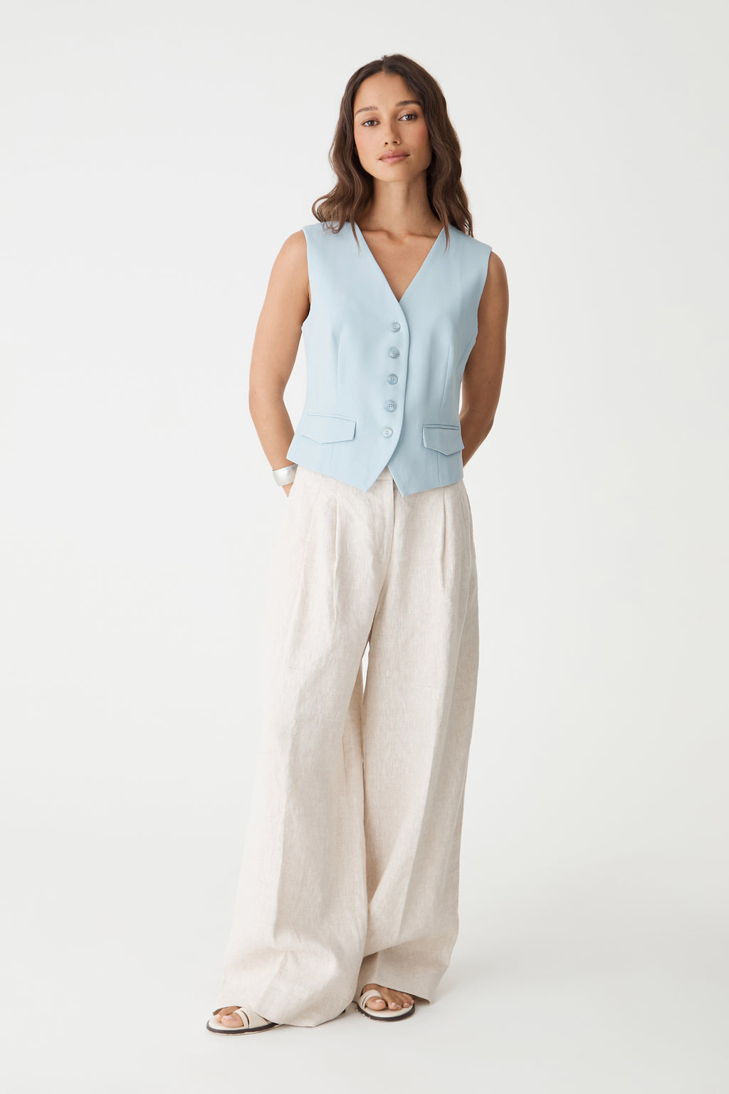 Melanie Tailored Vest in sky blue, front view worn with cream wide-leg trousers
