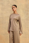 Asma Satin Bias Top in mocha, front view with boat neckline and long flared sleeves, worn with matching satin pants