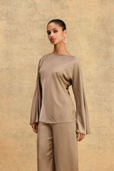 Asma Satin Bias Top in mocha, front view with boat neckline and long flared sleeves, worn with matching satin pants