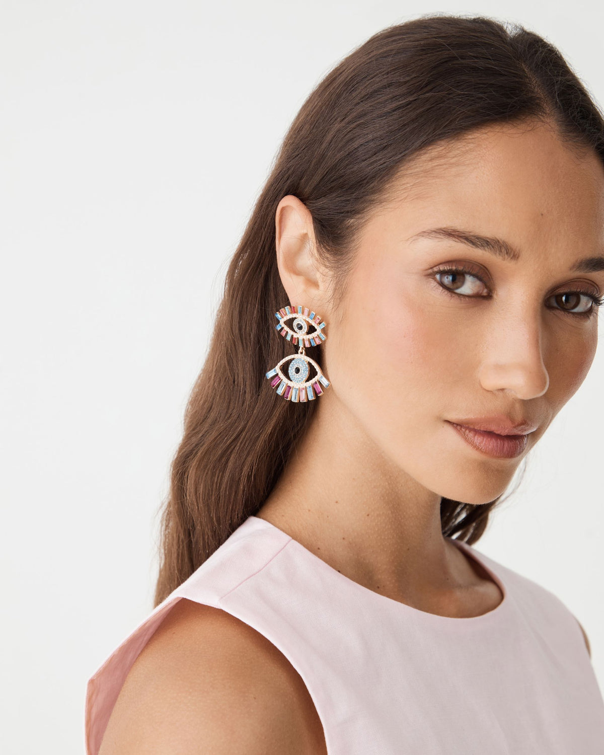 Rainbow Eye Drop Earrings worn, front view of face with hair tucked behind ear